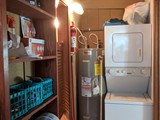 laundry room divides kitchen from Living room