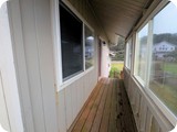covered porch door to yar off of living room
